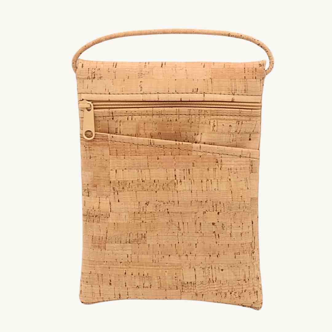 Close-up of the beige cork leather strap with silver hardware detail on the Be Lively vegan crossbody bag from a front angle.