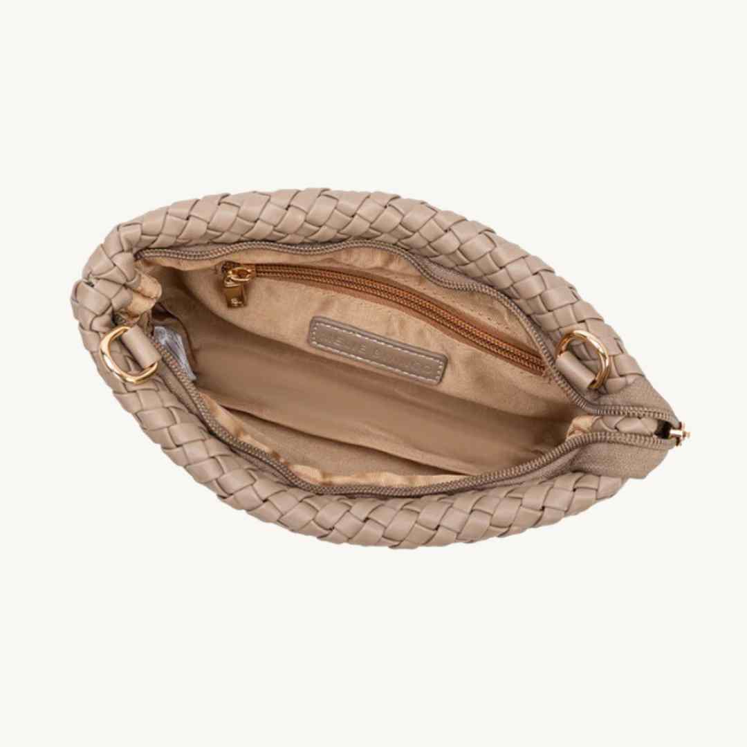 Close-up of woven recycled PU leather textured surface on the Daisy Vegan Crossbody Clutch, showing intricate weaving detail