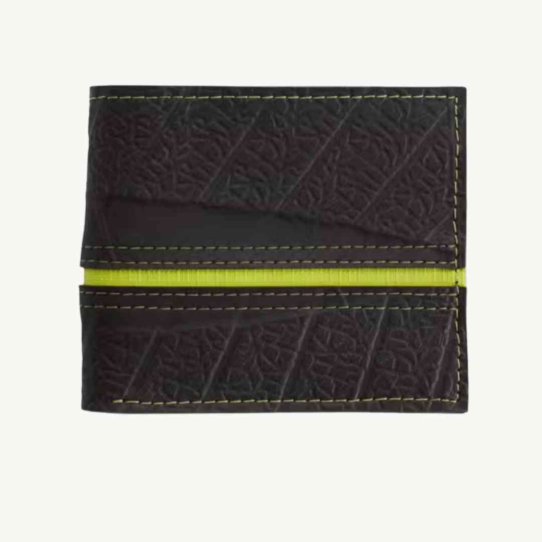 Close-up of the vegan vegan wallet’s textured cork material with embossed logo detail and 3.5-inch width shown from an