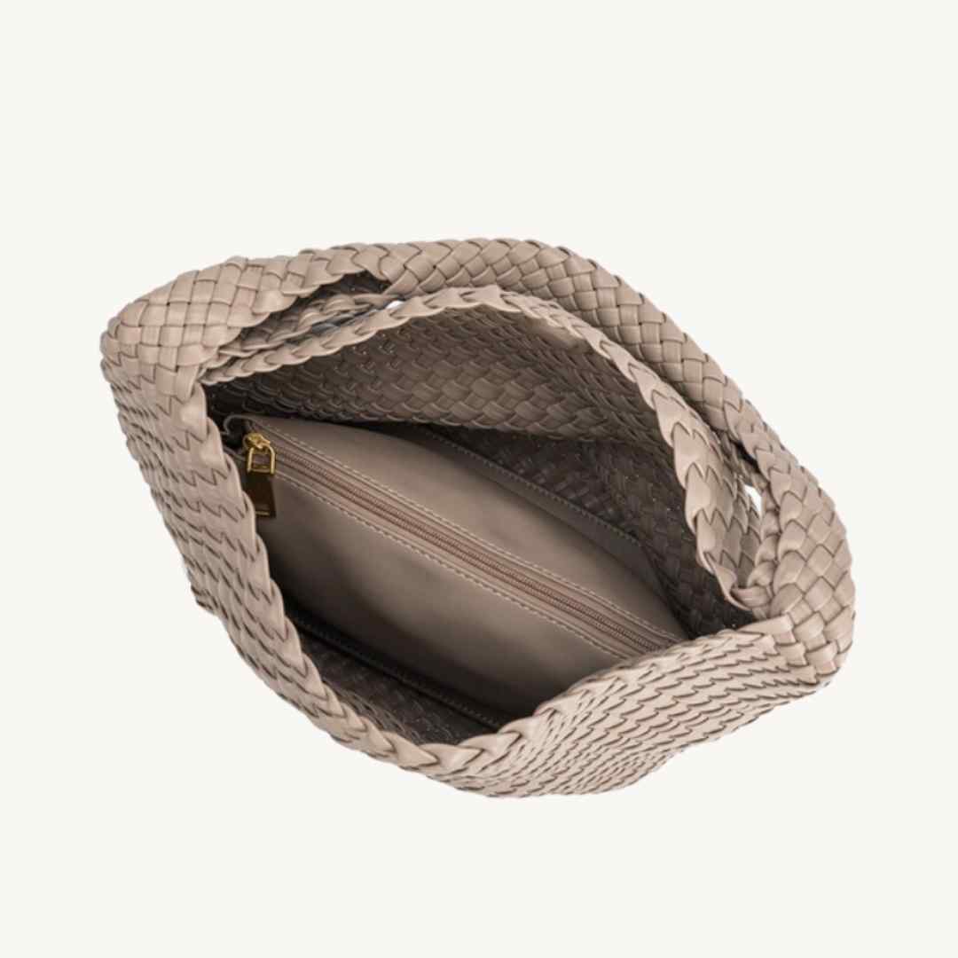 Close-up of the Johanna woven recycled vegan leather tote’s textured surface and slouchy, spacious silhouette from a front