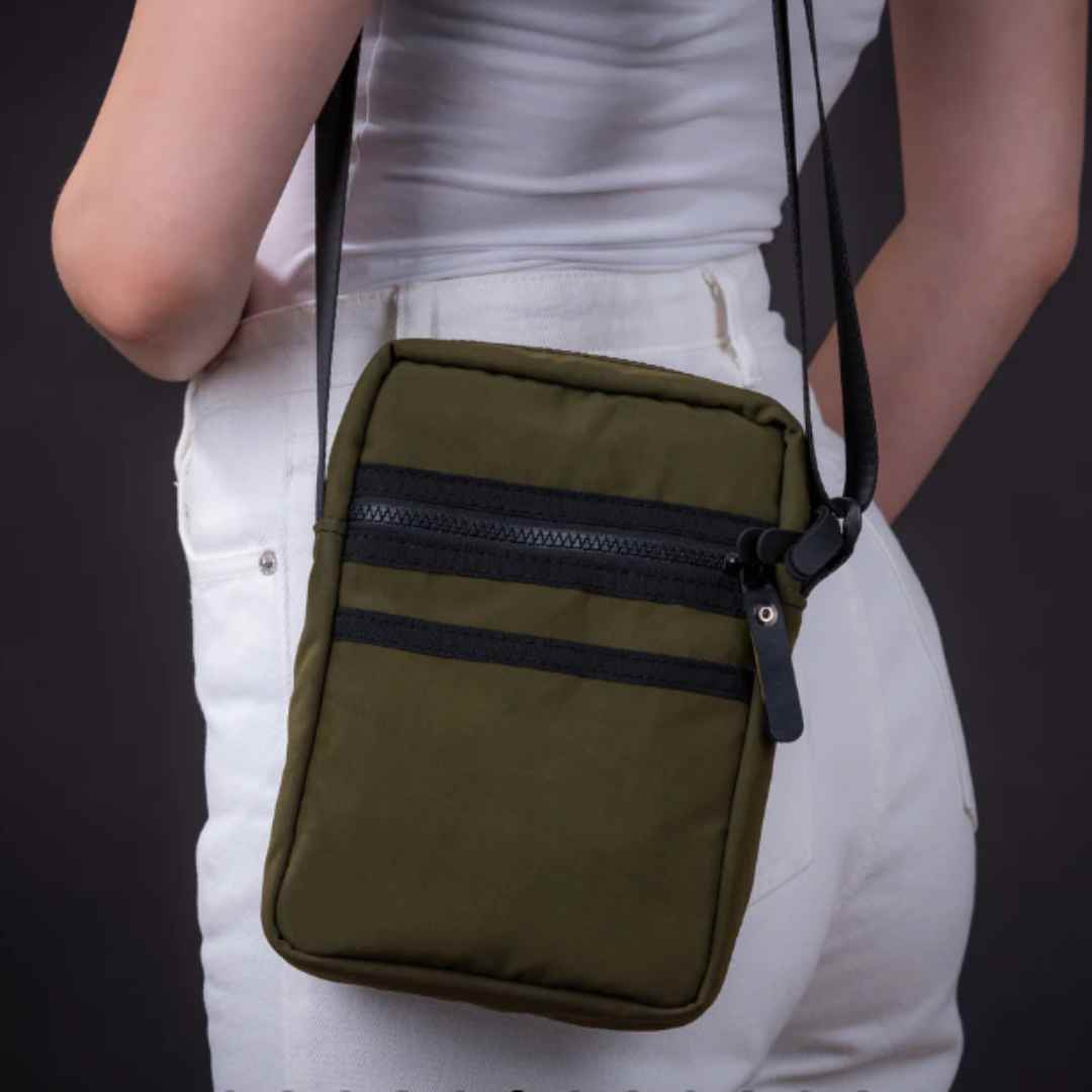 Close-up of the Major Vegan Crossbody Reporter Bag’s adjustable strap buckle, highlighting upcycled rubber texture and