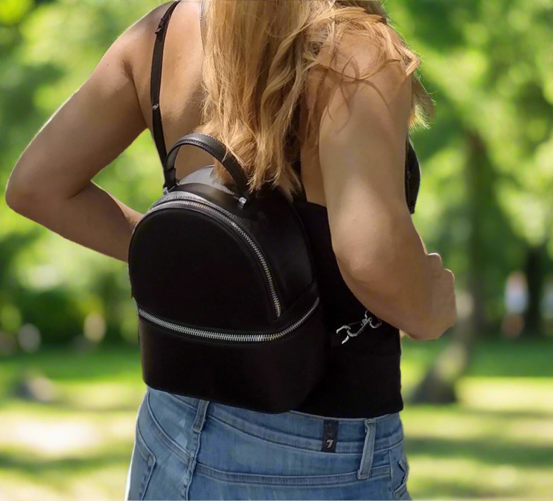 Overhead view highlighting the Ame Vegan Leather Appleskin™ mini backpack's slim silhouette and textured coral color with