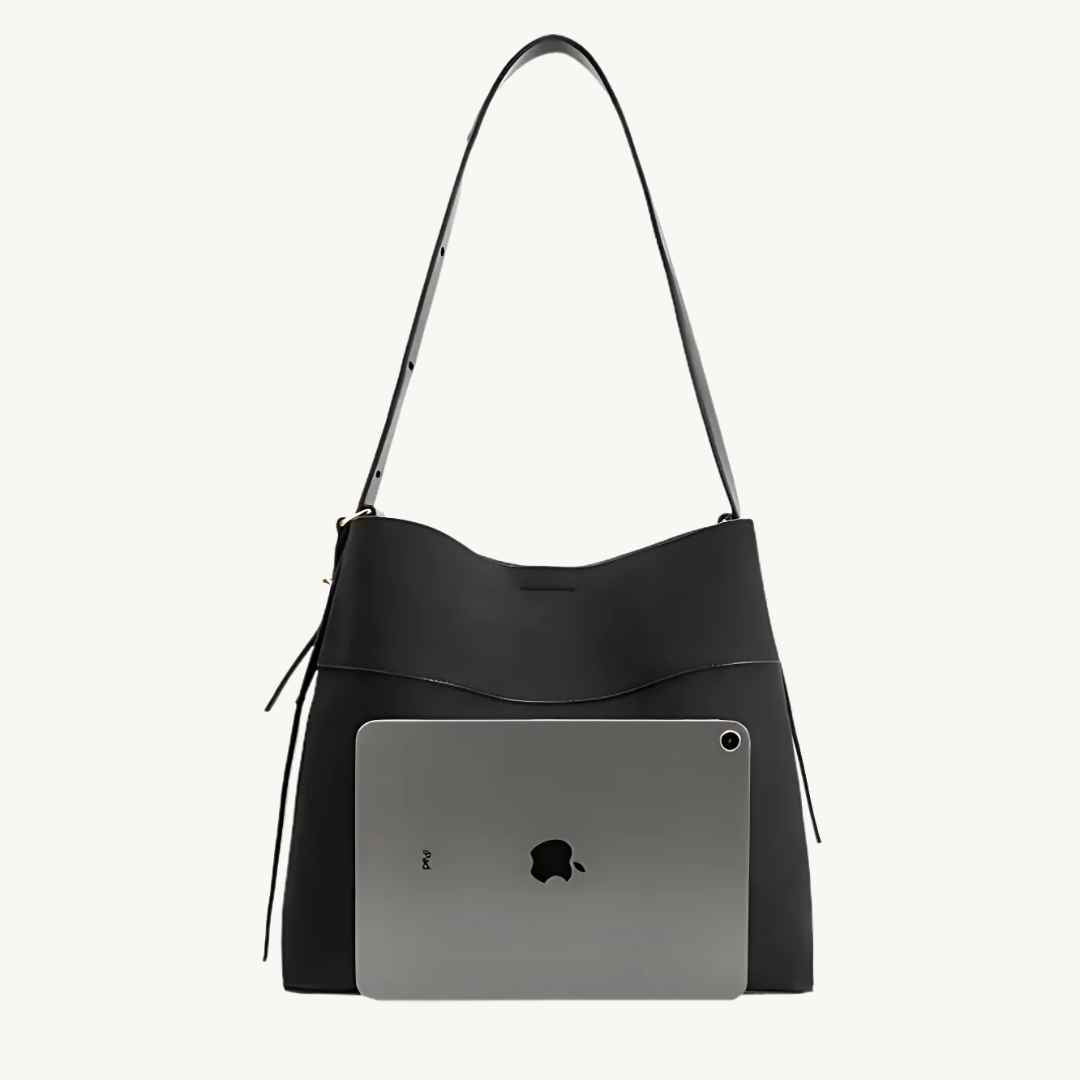 Close-up of black vegan suede tote bag handle showing textured surface and reinforced stitching detail