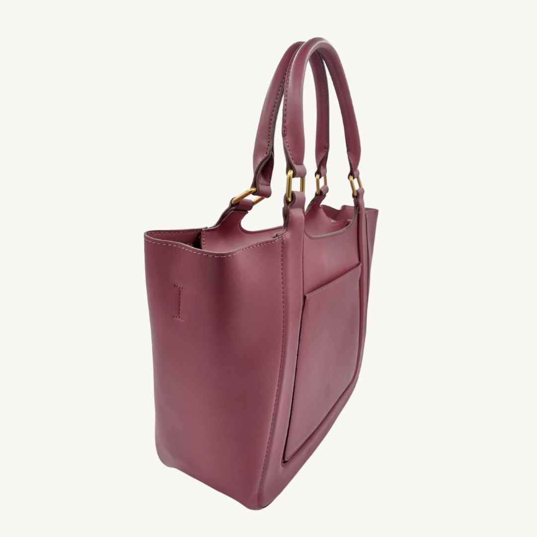 Close-up of recycled vegan leather crossbody strap attachment featuring matte finish and reinforced stitching detail.