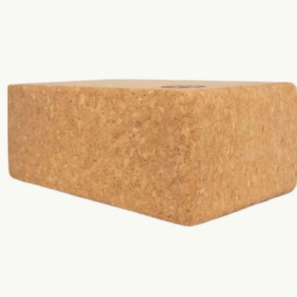 Close-up of textured cork surface highlighting natural grain and matte finish of the Grounded yoga block from an overhead