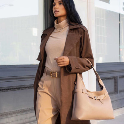 vegan leather tote bag in taupe with a woman walking