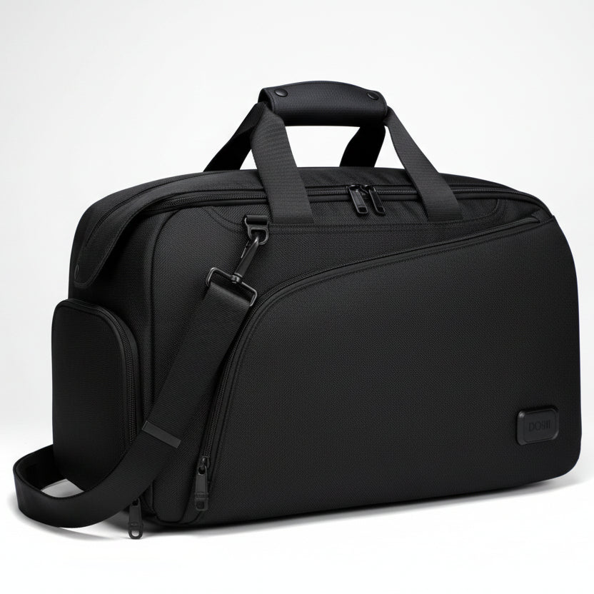 Black vegan travel bag with shoulder strap on a white background