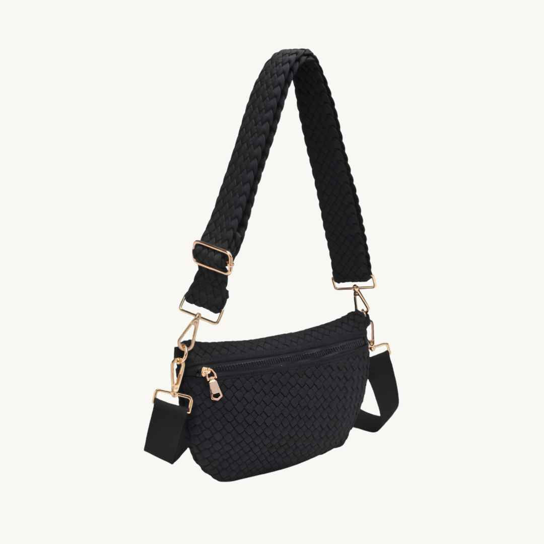 Black vegan woven crossbody bag with a braided shoulder strap and gold-tone hardware, shown on a plain off-white background.