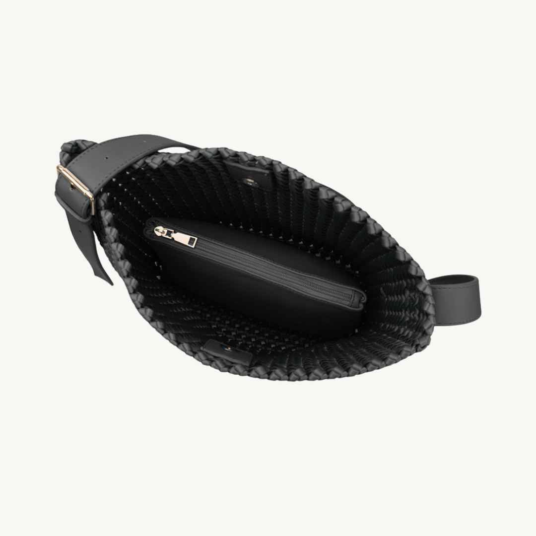 Black woven vegan handbag with adjustable strap on the inside