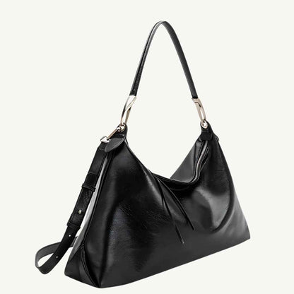 Close-up of Charlie Vegan Tote Bag's recycled vegan leather strap detail showing textured finish and stitched edge