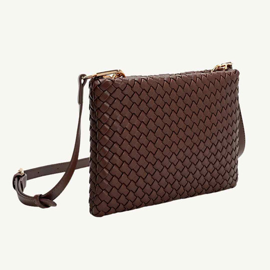 Close-up of woven recycled PU leather texture on the Daisy vegan crossbody bag’s strap detailing with subtle stitching