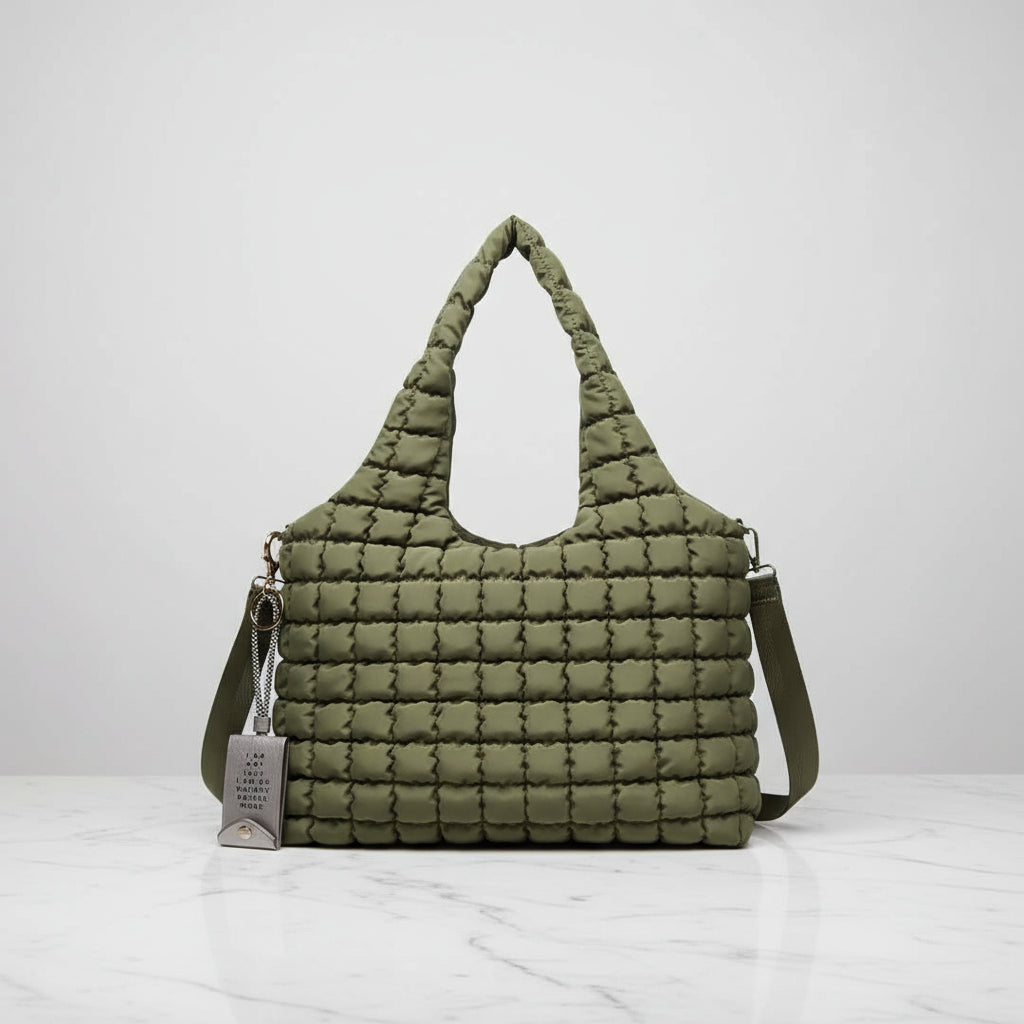 Green quilted vegan handbag with a keychain iphone charger 