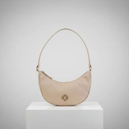 Close-up of the wine-colored vegan leather exterior with textured cactus and corn leather accents on the Moon Bag’s front