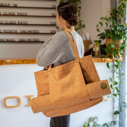 Close-up of the cork yoga mat's textured surface with subtle grain patterns and a natural wood-like finish for improved grip.