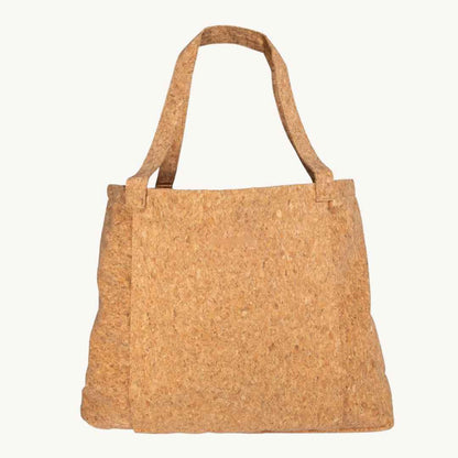 Close-up of cork yoga mat edge highlighting textured, natural grain with folded corner showcasing durability and