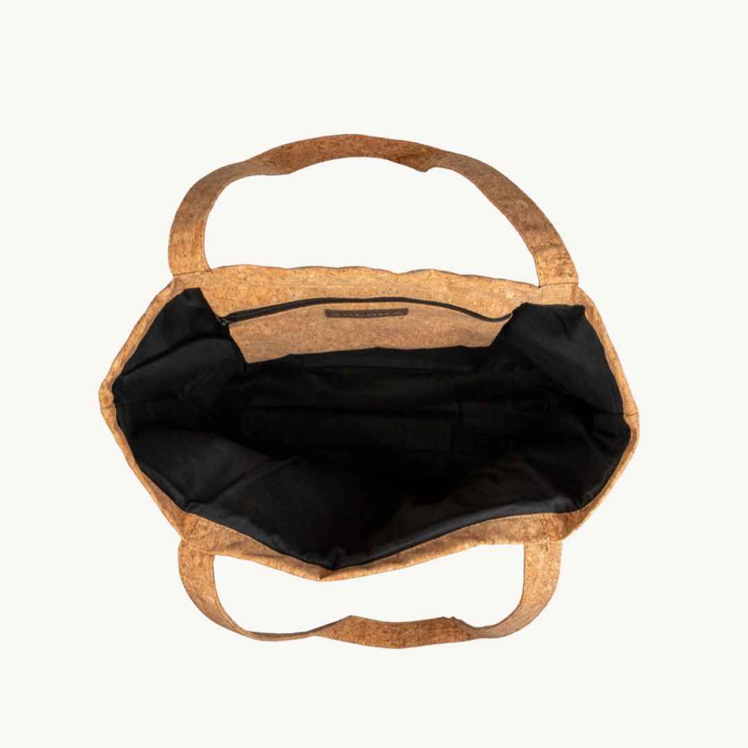 Cork handbag with black interior on a white background