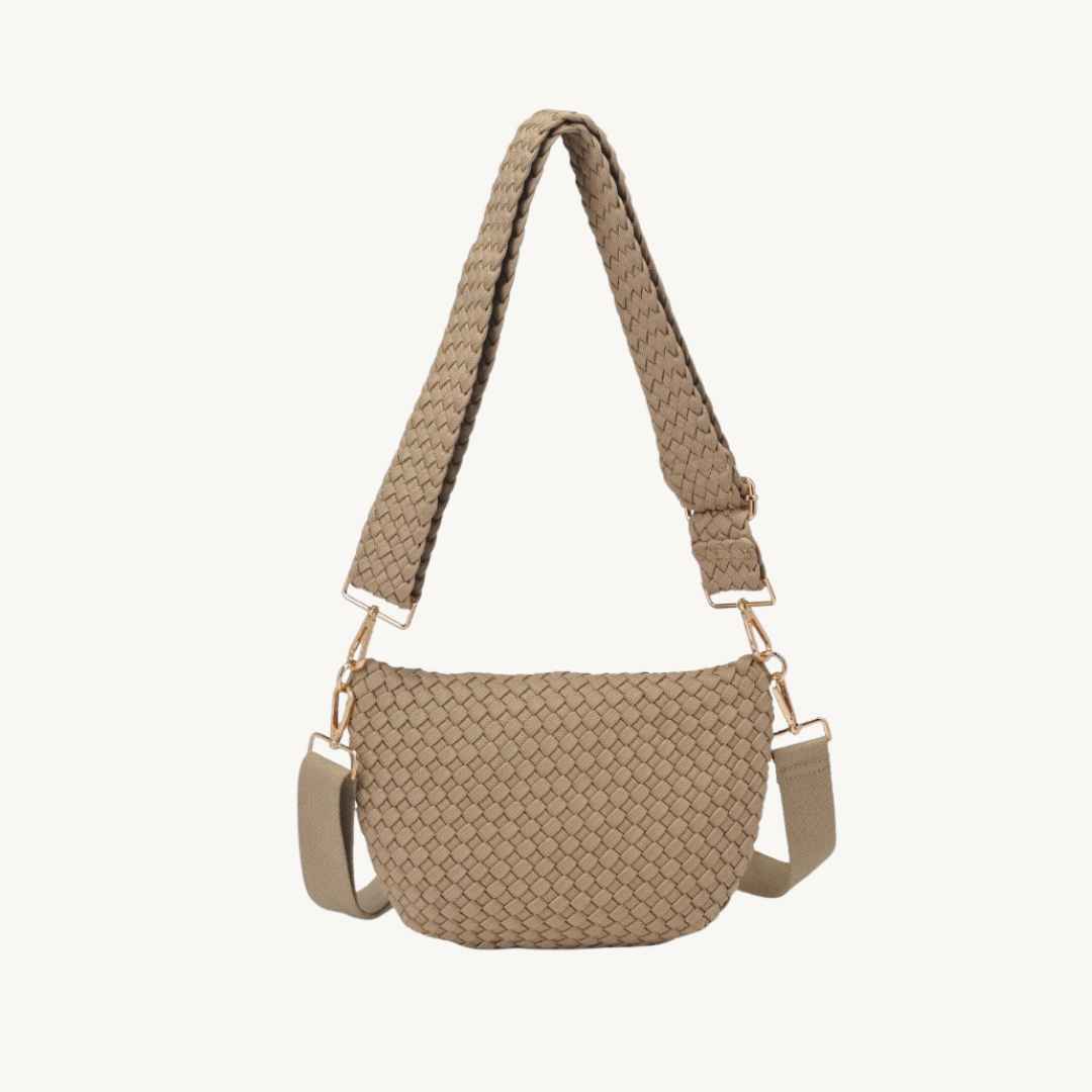 A beige woven vegan leather bag with a matching woven strap and gold-tone hardware 