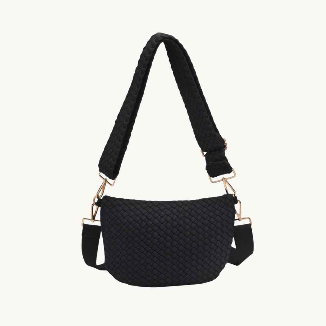 A black woven vegan crossbody bag with a wide braided shoulder strap and gold-tone hardware