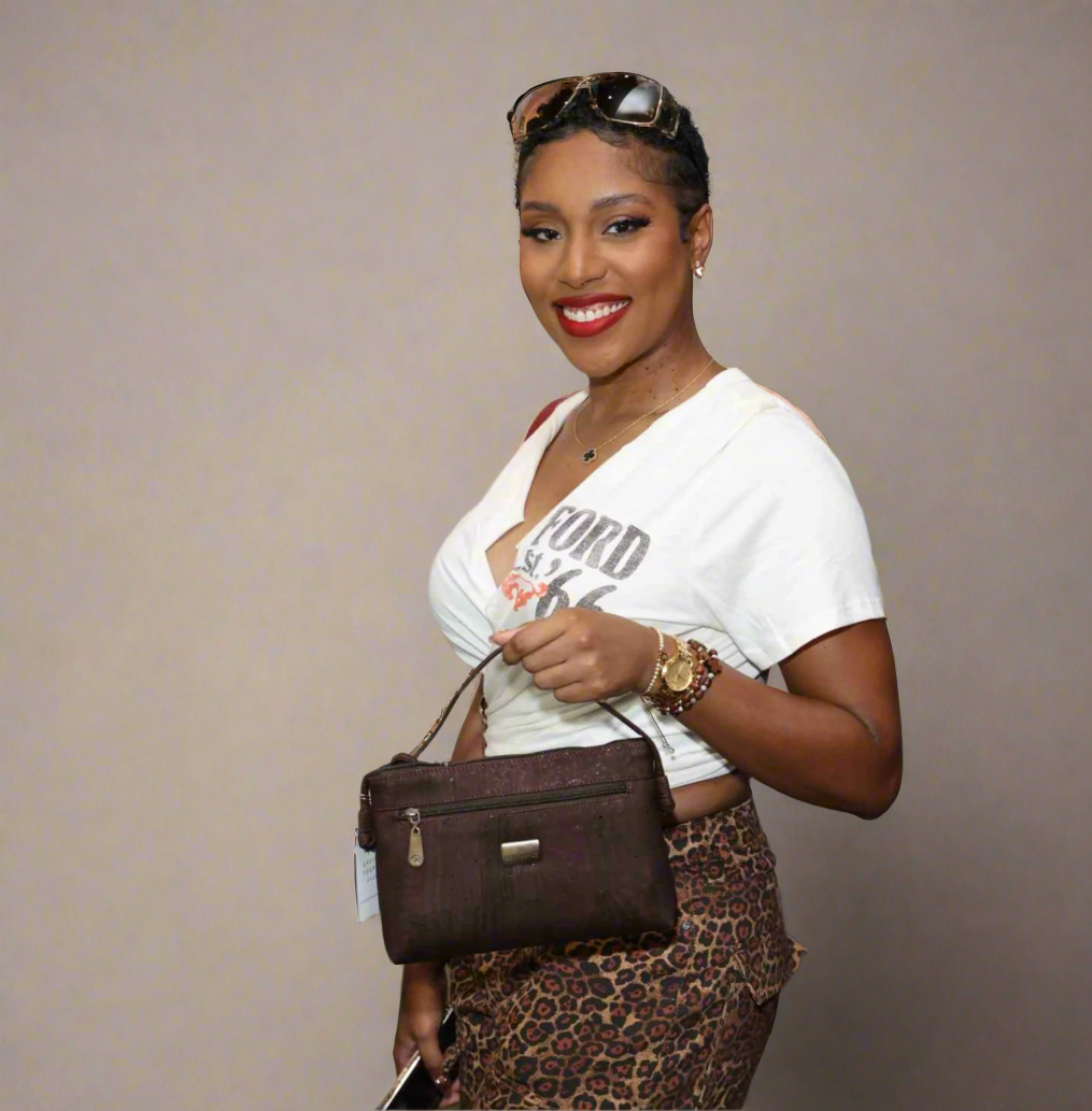 Close-up of the Iris Crossbody Bag's textured cork vegan leather strap detail with subtle stitching and waterproof finish