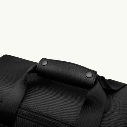 large black vegan duffle bag for work and travel up close handles