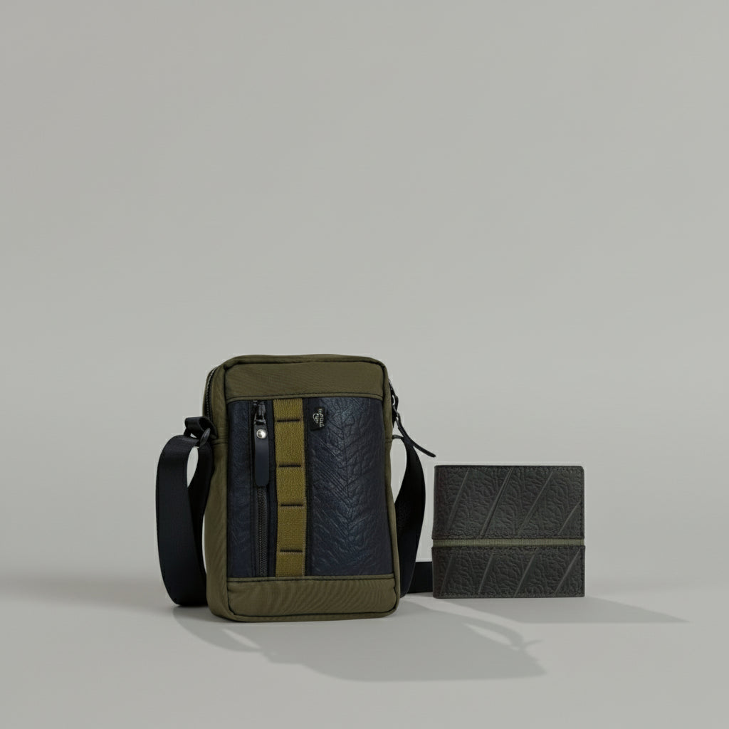 Green and black crossbody bag with a matching pouch on a light gray background