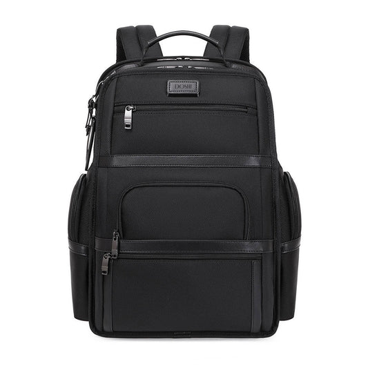 Black backpack with multiple pockets and zippers on a white background