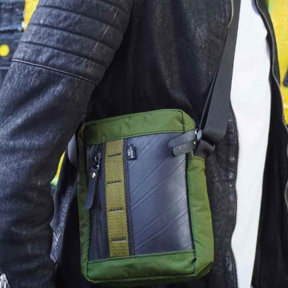 Close-up of the Major Vegan Crossbody Reporter Bag’s adjustable military canvas strap buckle detail
