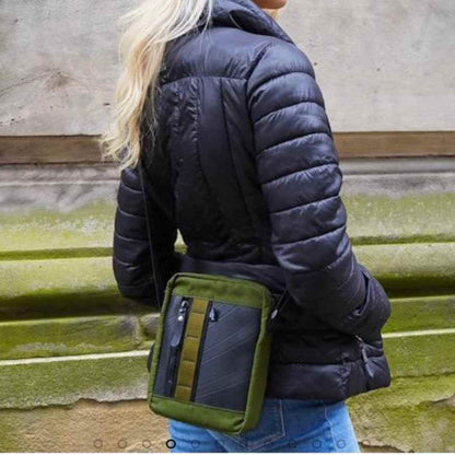 Close-up of the Major Vegan Crossbody Reporter Bag’s textured upcycled rubber strap detail from a front-side angle