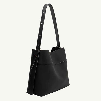 Close-up of black vegan suede tote bag's textured surface and sturdy 