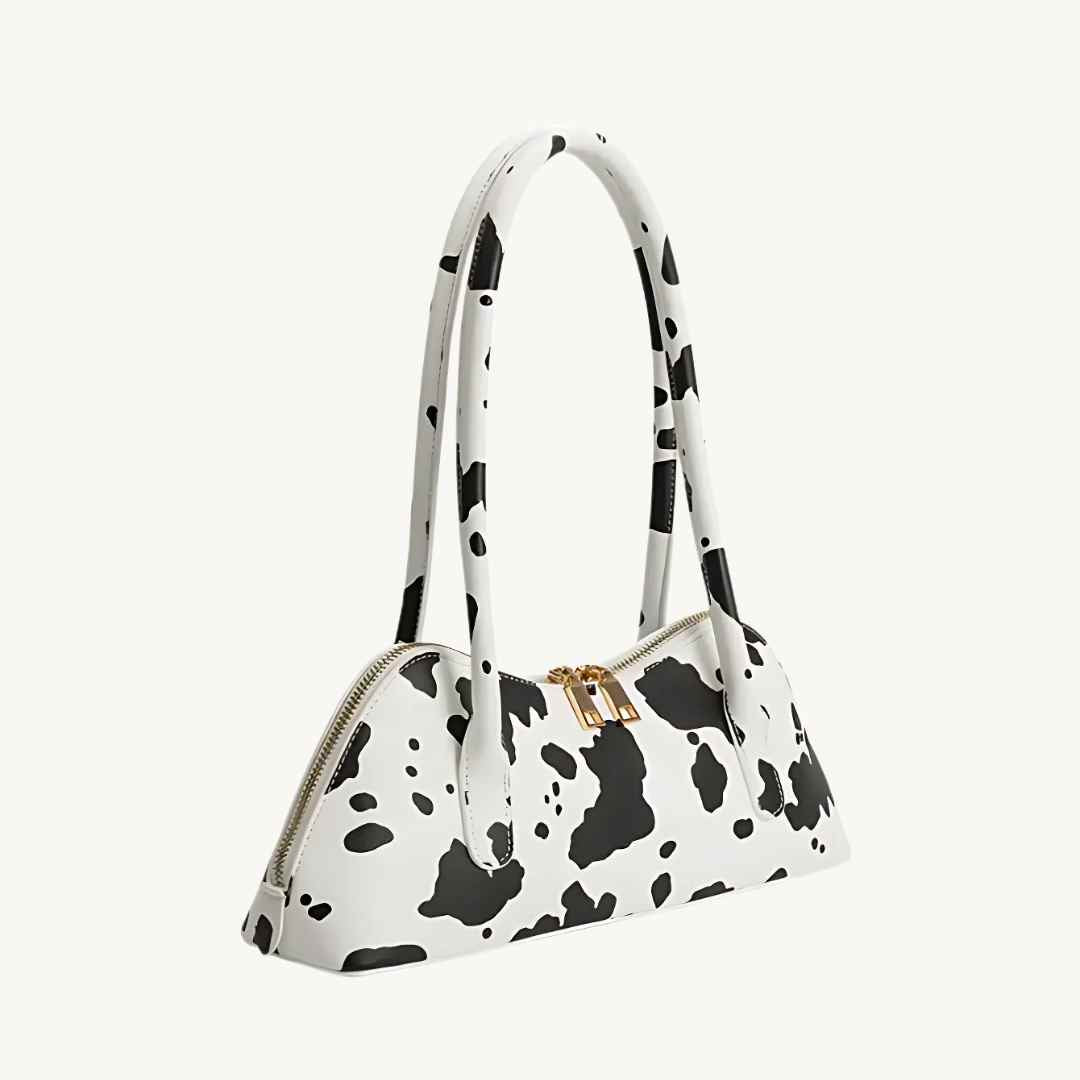vegan leather handbag with cow print